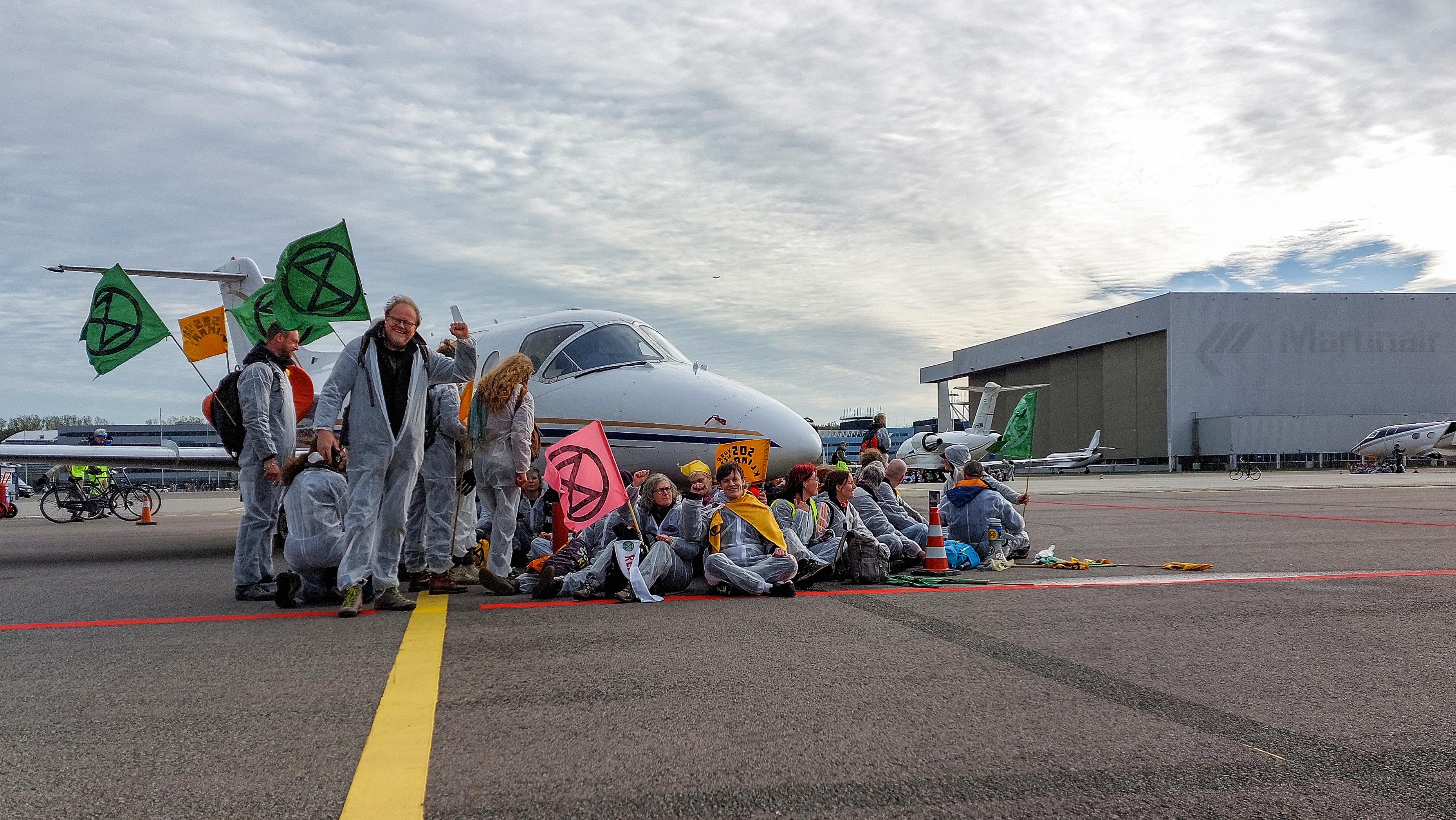 Activists block a private jet at Schiphol airport