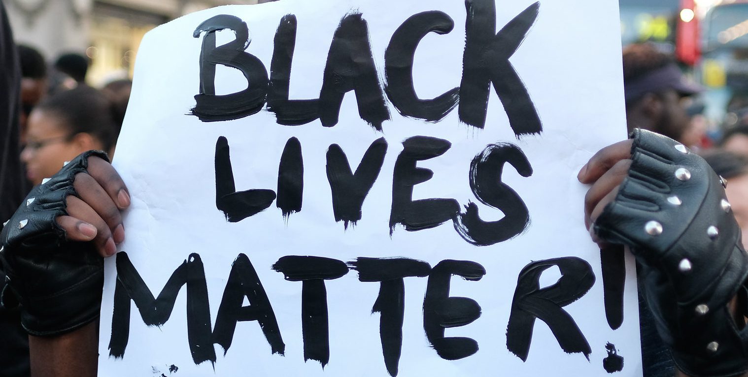 A Black Lives Matter sign at an anti-racist protest in London. Credit: Alisdare Hickson / Flickr